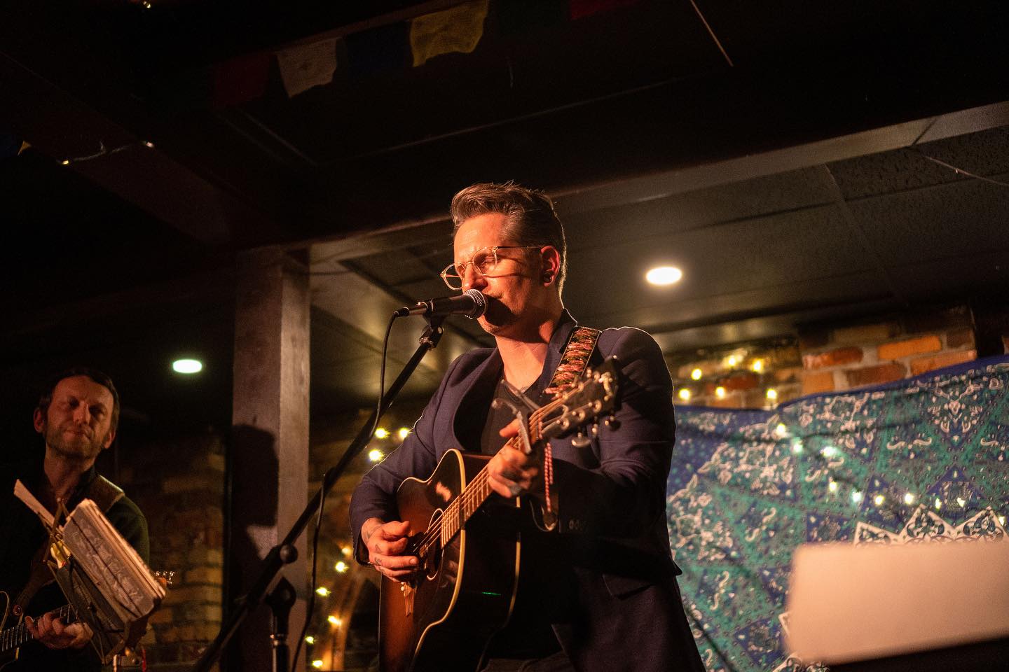 A singer performing on stage.